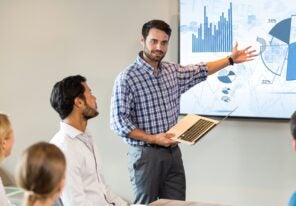 A team member presenting data to their team