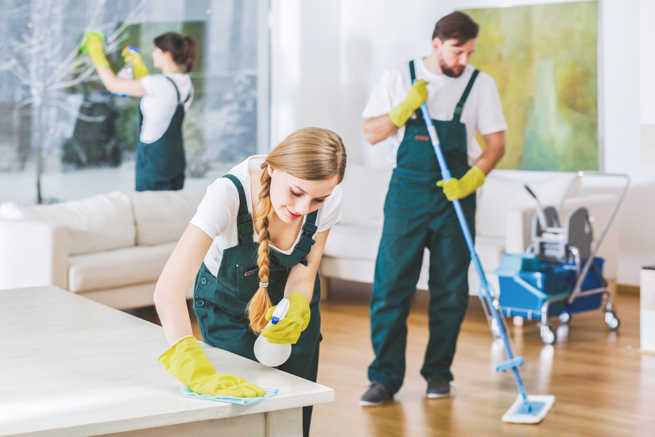 a cleaning crew cleaning a space