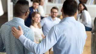 a newly hired employee is presented to the team