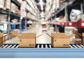 open shipping boxes on a conveyor belt