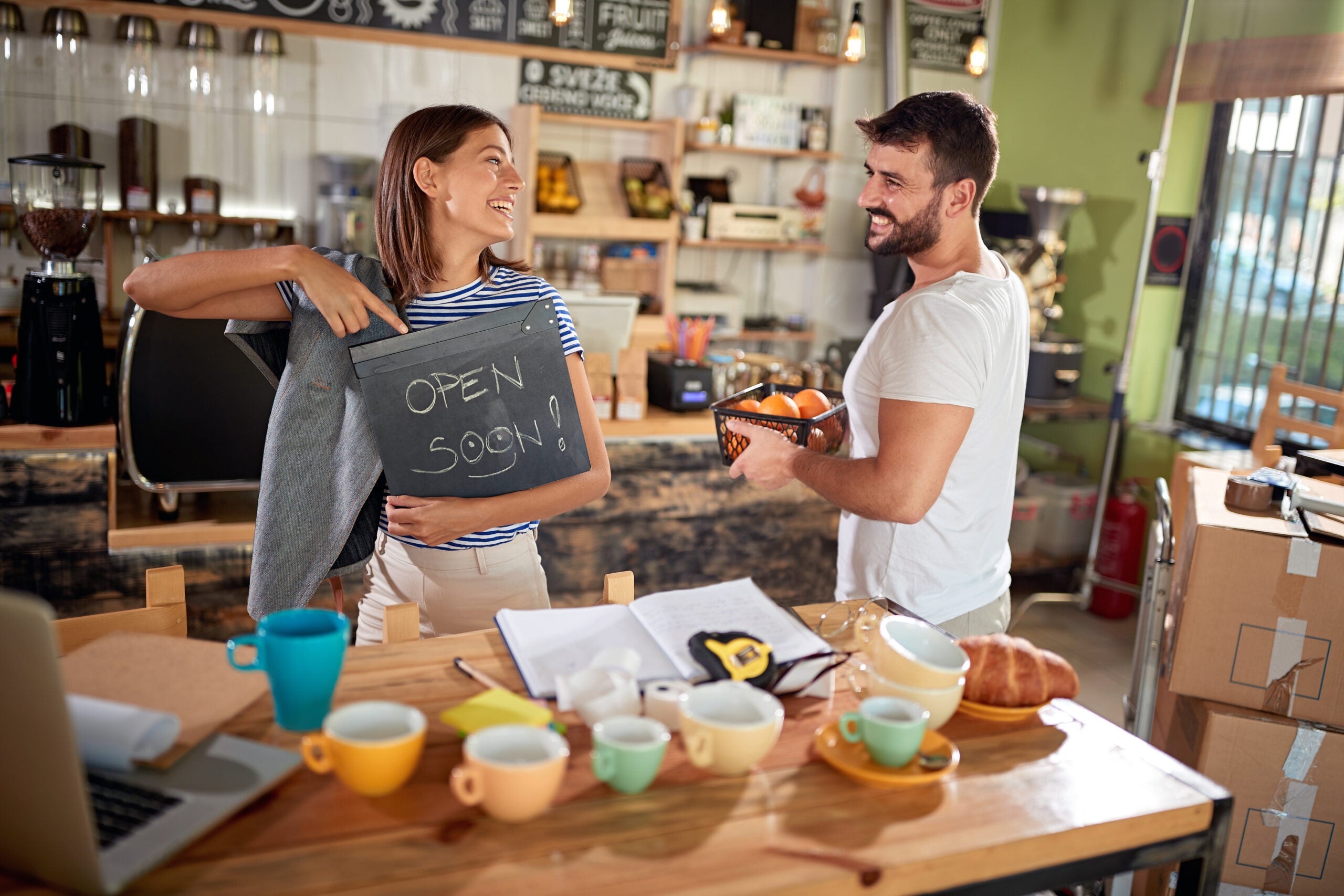 young couple opening cafe of their own. enthusiastic, startup business