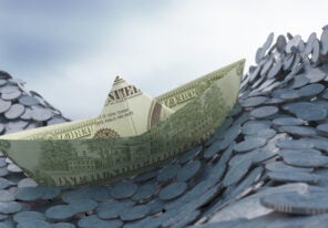 a stylized photo of a boat made of money navigating waves of coins