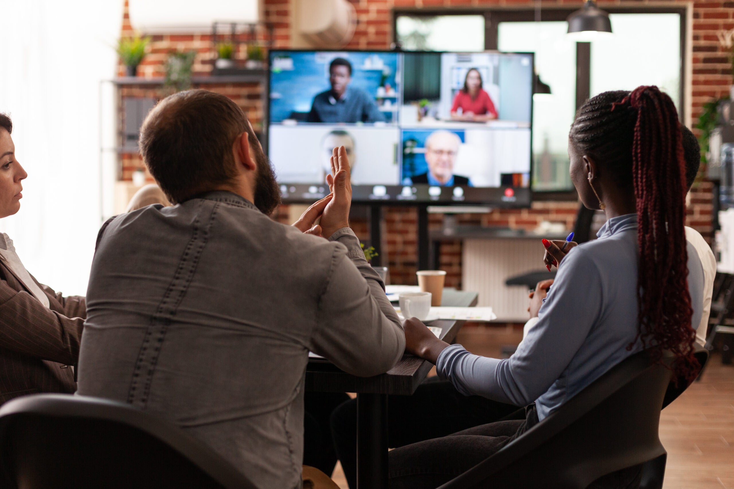 a team of employees having a virtual meeting