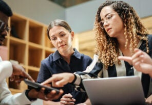 a group of employees reviewing their response plan