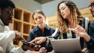 a group of employees reviewing their response plan