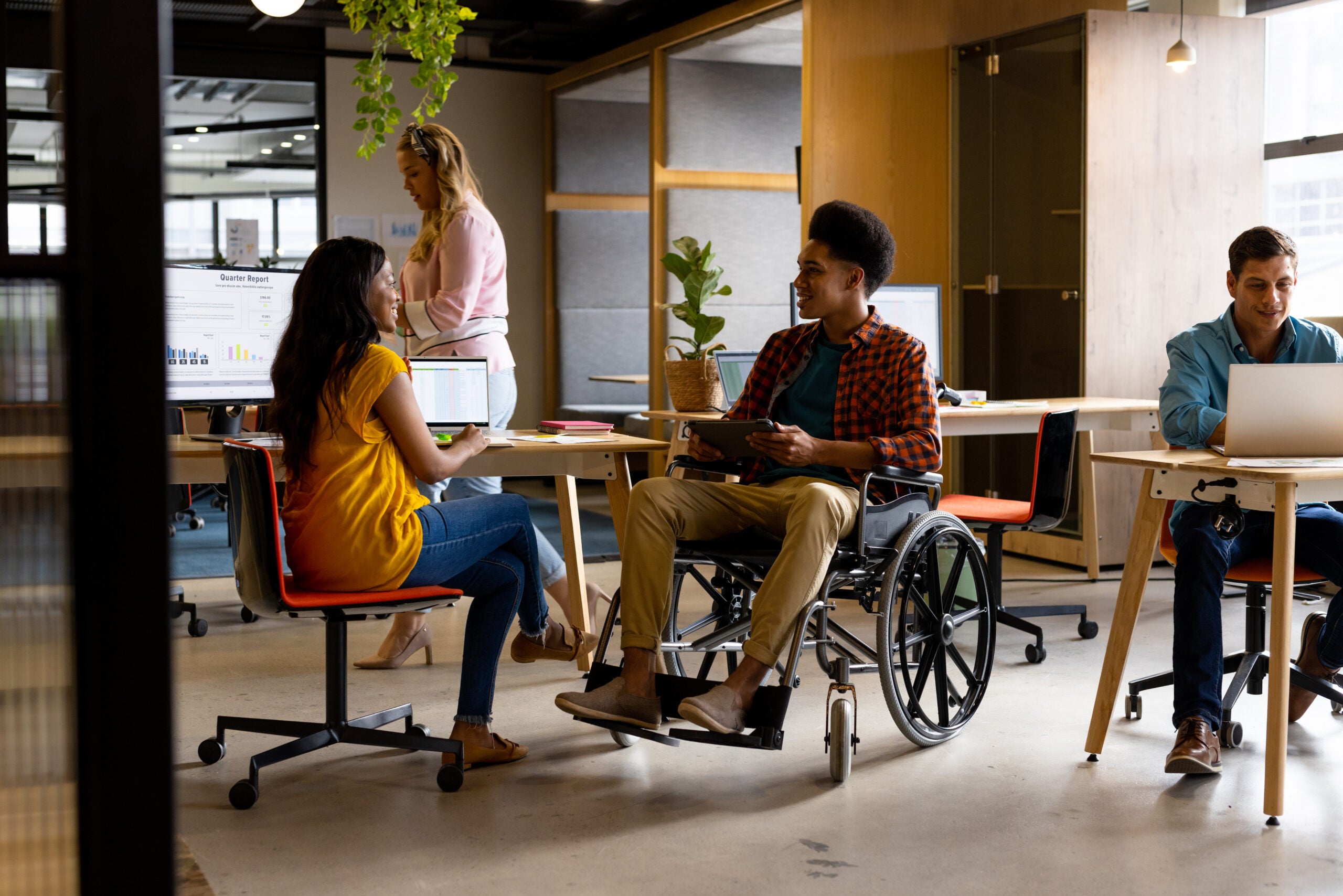 an accessible workplace full of happy diverse employees