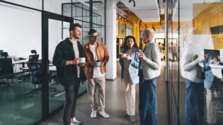 a group of colleagues using their break time to have a conversation