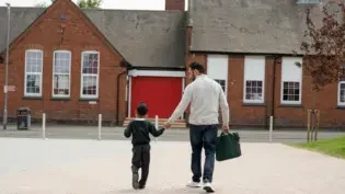 A father and his daughter walking from daycare