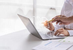 two people analyzing data from reports together