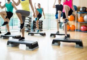 a fitness class exercising in a studio