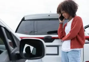 a woman taking the necessary steps after a car accident