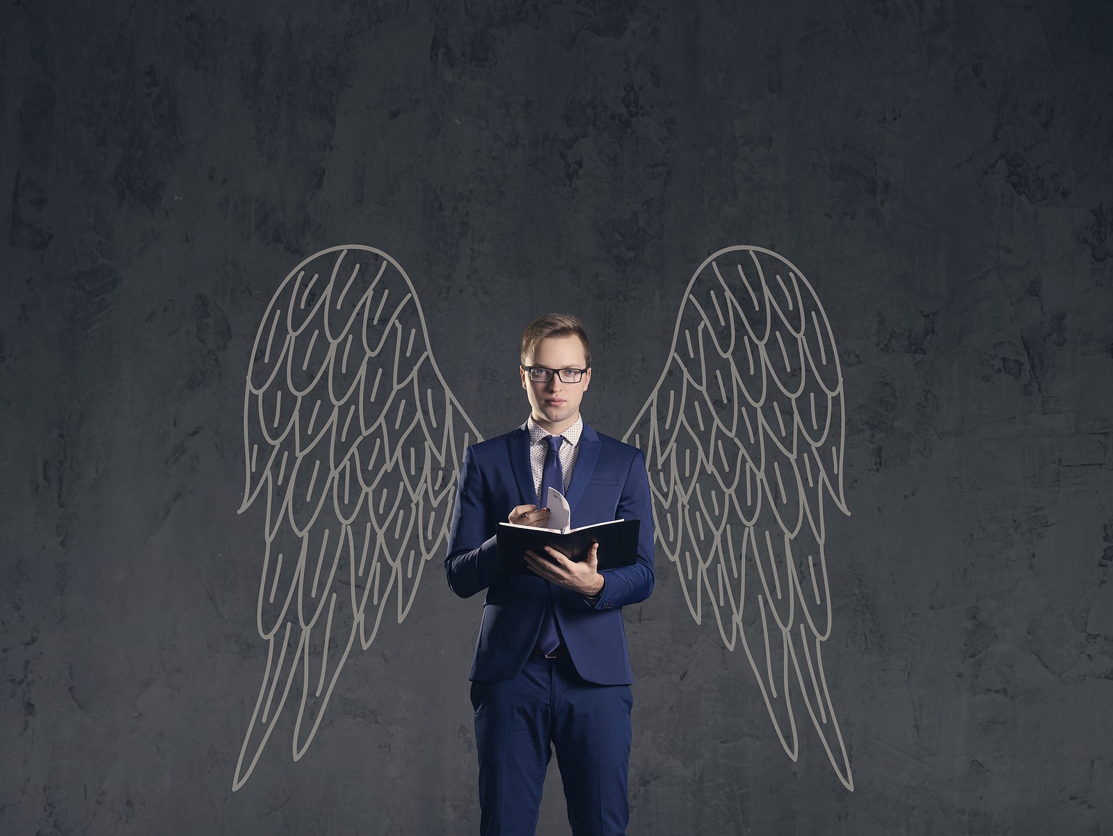 Business angel on a dark background. Investment, business, sponsor concept