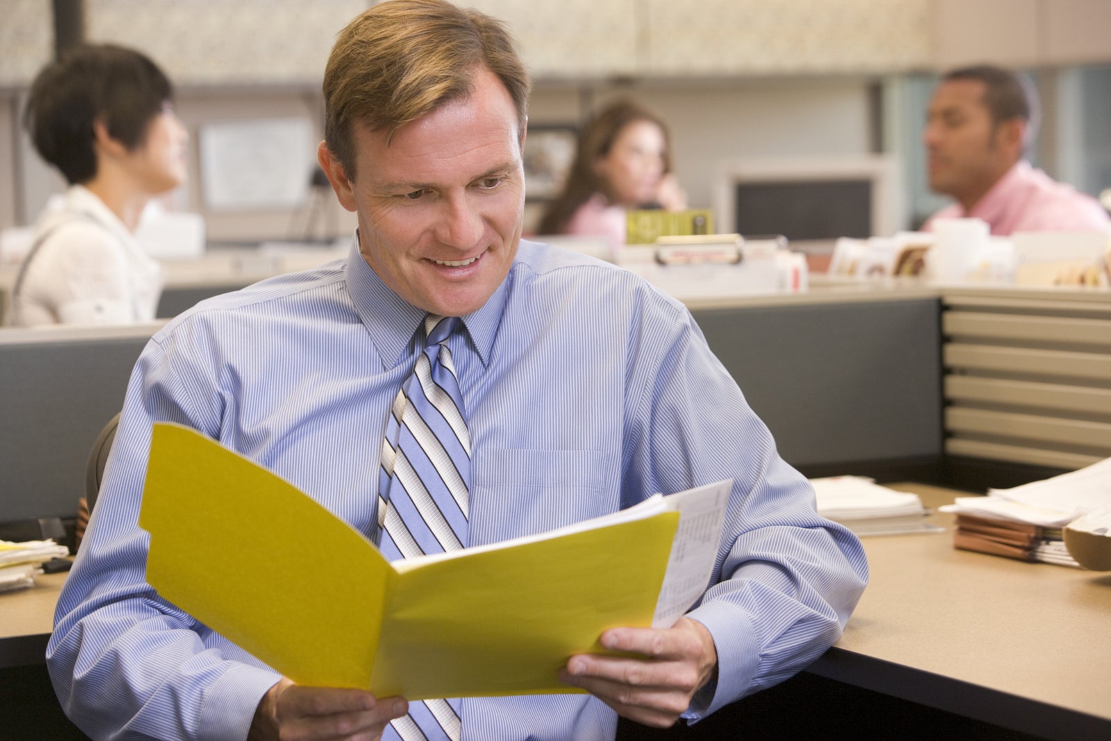 Portrait of business man in busy office