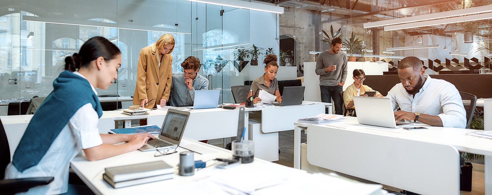 Busy day. Group of multiracial business people working together in the creative co-working space. Team building concept. Office life. Web banner