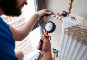 a plumber working in an apartment