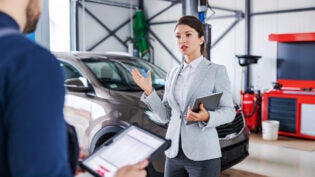 a business person frustrated with a mechanic's price quote