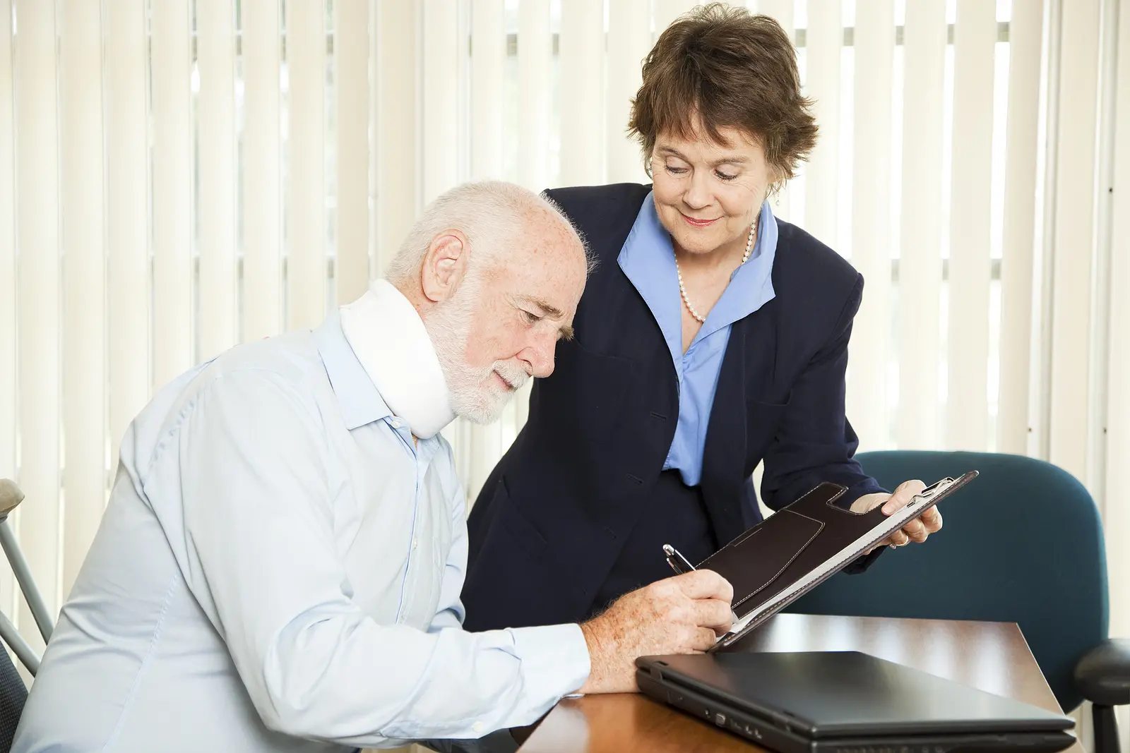 a personal injury lawyer working with an injured man