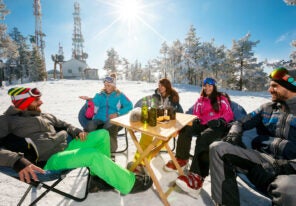 a group of middle aged people enjoying a vacation in the snow