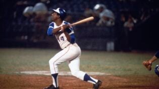 Hank Aaron hitting homerun