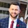 Young professional man in beard and suit