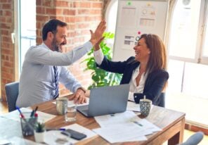 coworkers giving each other a high five