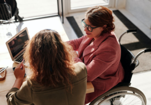 a woman speaking with her lawyer